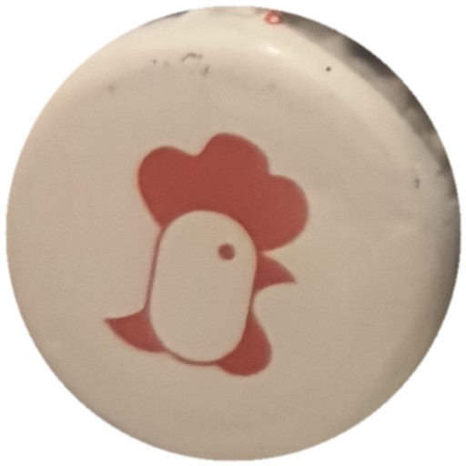 Tête de coq rouge sur blanc